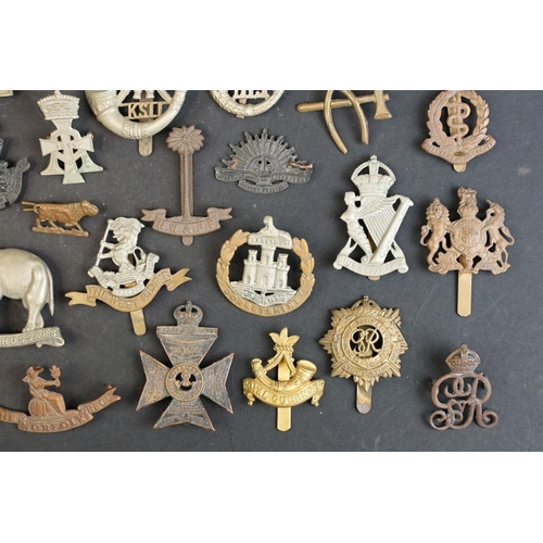 263 - A collection of approx fifty mainly British military regimental cap and collar badges to include the... 