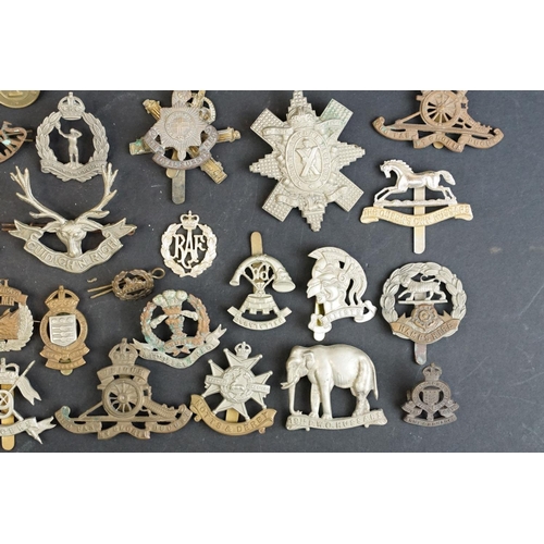 264 - A collection of approx fifty mainly British military regimental cap and collar badges to include the... 