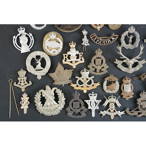 264 - A collection of approx fifty mainly British military regimental cap and collar badges to include the... 