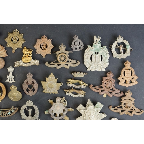 264 - A collection of approx fifty mainly British military regimental cap and collar badges to include the... 