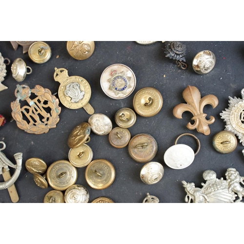 266 - A collection of over forty mainly British Regimental cap and collar badges together with a selection... 