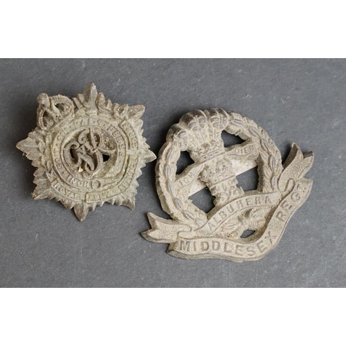 267 - A collection of eleven British World War Two / WW2 plastic economy cap and collar badges to include ... 