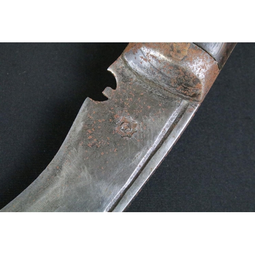 298 - An early to mid 20th century Kukri knife, steel blade with single groove fuller and sun face stamp, ... 