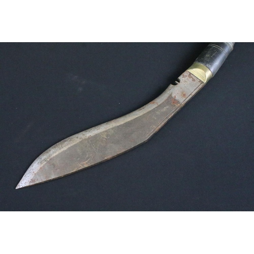 299 - A mid to late 20th century Kukri knife, single groove fullered steel blade, turned horn handle, blad... 