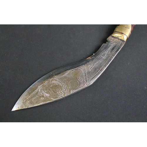 305 - A Nepalese tourist Kukri knife, highly decorative polished steel blade, turned wooden handle with br... 