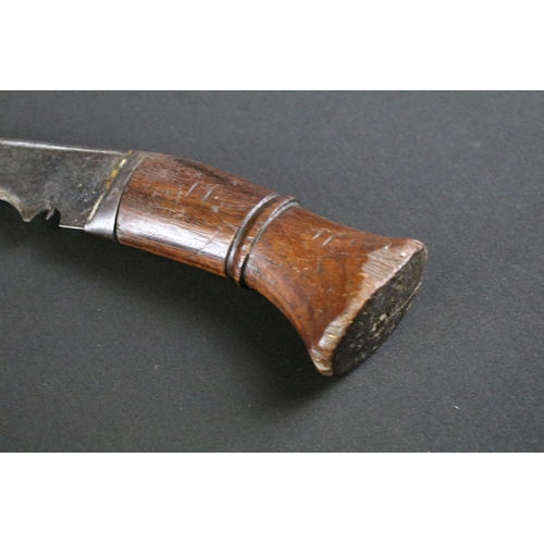 312 - A mid 20th century World War Two / WW2 era Kukri knife, single groove fullered steel blade, turned w... 