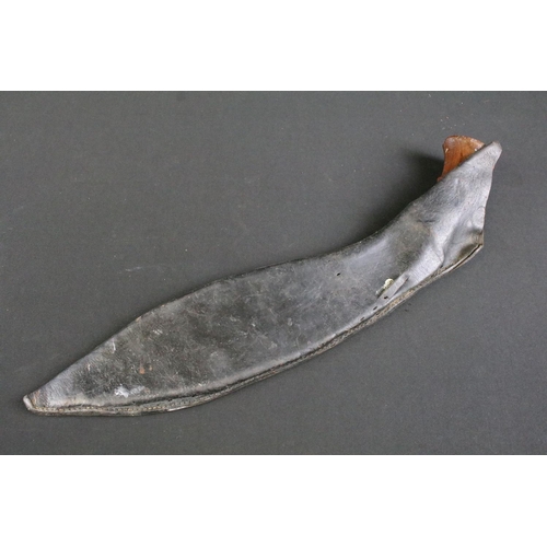 312 - A mid 20th century World War Two / WW2 era Kukri knife, single groove fullered steel blade, turned w... 