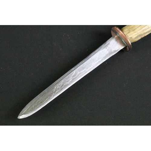 318 - A early 20th century trench / fighting knife, re-adapted cut down double edged blade, hand crafted c... 