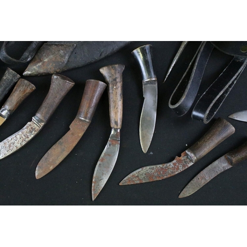 330 - A collection of Kukri small knives and sharpeners together with two leather covered scabbards and a ... 