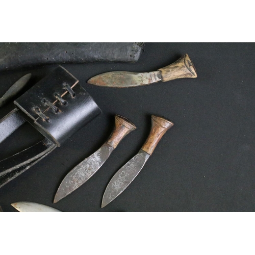 330 - A collection of Kukri small knives and sharpeners together with two leather covered scabbards and a ... 