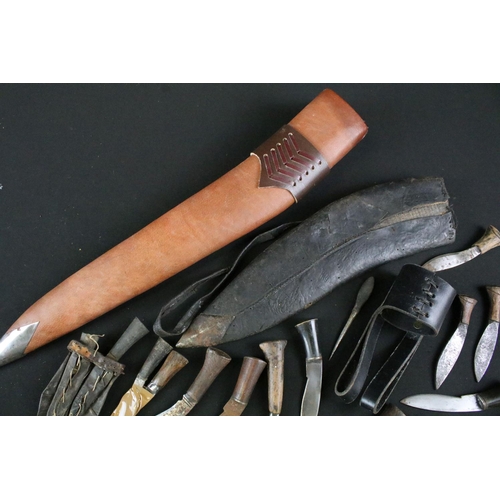 330 - A collection of Kukri small knives and sharpeners together with two leather covered scabbards and a ... 