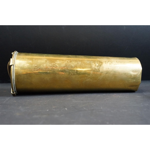 335 - A British World War One / WW1 18 P.R. brass artillery shell together with two antique canon balls.