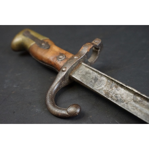 336 - A French World War One / WW1 era M1874 Gras Bayonet (St. Etienne, Fevier 1877) together with scabbar... 