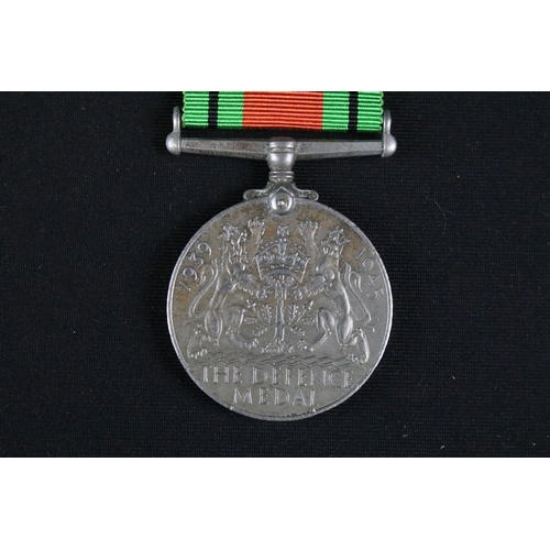 34 - A group of three British full size World War Two / WW2 medals to include the 1939-1945 Defence Medal... 