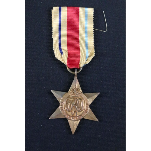 34 - A group of three British full size World War Two / WW2 medals to include the 1939-1945 Defence Medal... 