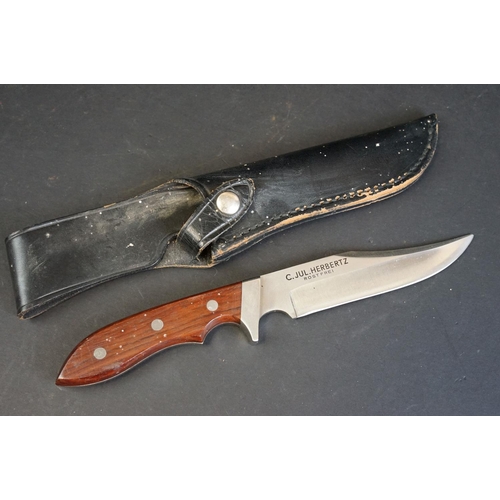 343 - A collection of three hunting / scouting sheath knives to include C. JUL. Herbertz of Rostfrei and J... 