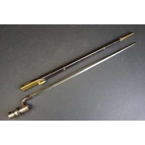 352 - A British 1876 pattern 'Martini Henry' socket bayonet, WD mark with broad arrow to blade and scabbar... 