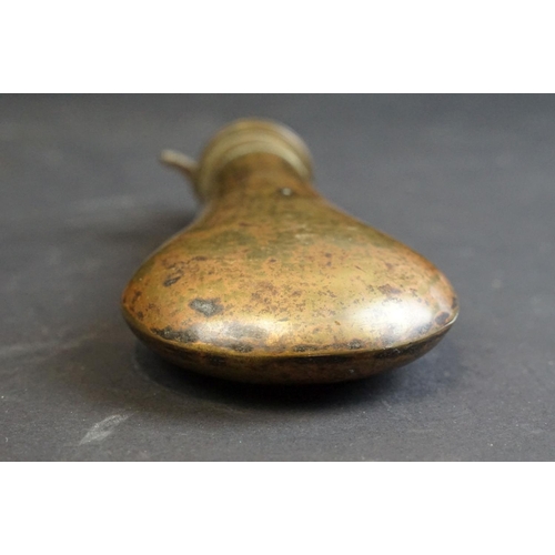 355 - Two antique powder / shot flasks to include a brass and a leather example.