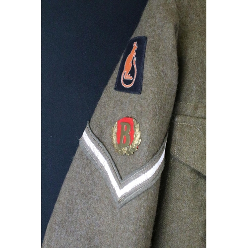 370 - A British military issued battle dress uniform comprising of blouse and trousers, dated 1954 and com... 