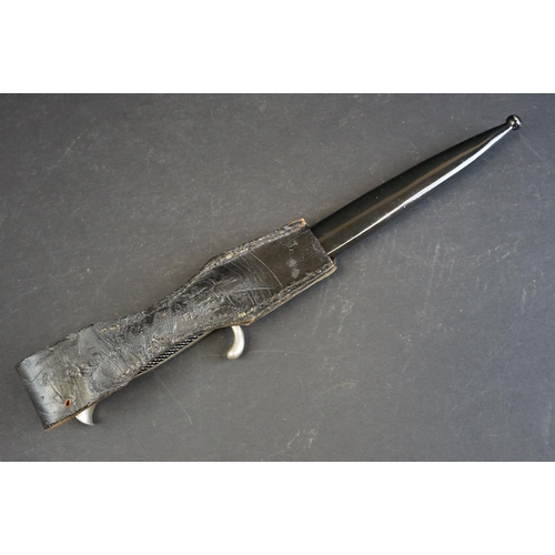 389 - A German Third Reich K98 dress bayonet, having a 25cm single edged fullered blade, with chequered tw... 