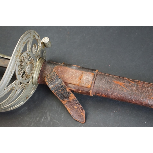 397 - A British 1822 pattern Coldstream guards officer sword complete with leather sheath (A/F)