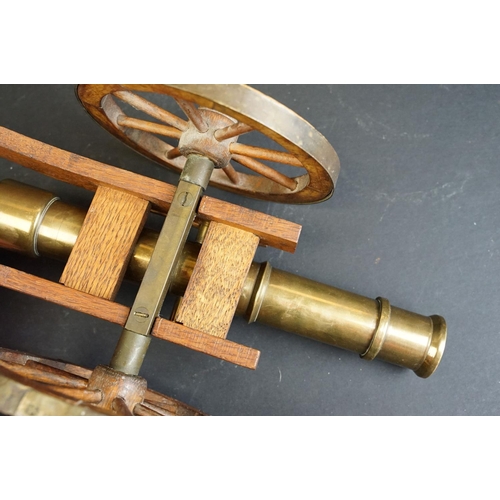 401 - A brass signal cannon mounted to wooden carriage with brass fittings, barrel length approx 29.5cm, o... 