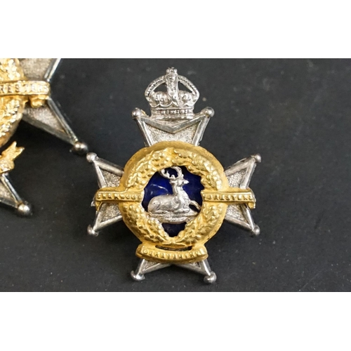 408 - A British The Derbyshire Regiment officers cap badge with Queen Victoria Crown together with a pair ... 