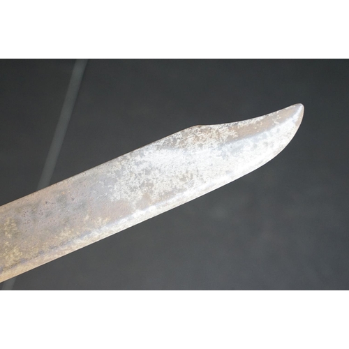 411 - A Dutch Klewang Sword / Machete, 62.5cm curved fullered blade with clipped back point, pierced sheet... 