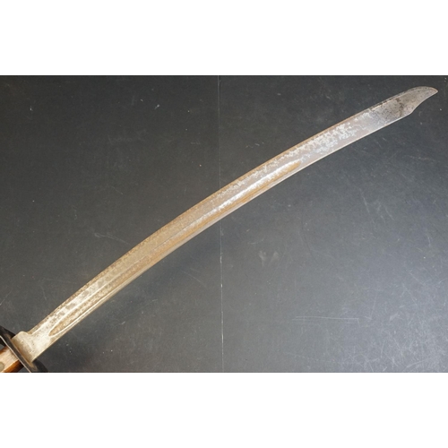 411 - A Dutch Klewang Sword / Machete, 62.5cm curved fullered blade with clipped back point, pierced sheet... 