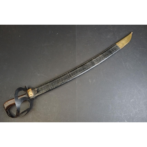 411 - A Dutch Klewang Sword / Machete, 62.5cm curved fullered blade with clipped back point, pierced sheet... 