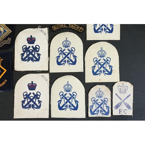 421 - A collection of British Royal Navy cloth badges to include HMS Ganges & HMS Surprise examples togeth... 