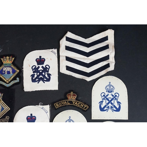 421 - A collection of British Royal Navy cloth badges to include HMS Ganges & HMS Surprise examples togeth... 