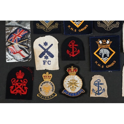 421 - A collection of British Royal Navy cloth badges to include HMS Ganges & HMS Surprise examples togeth... 