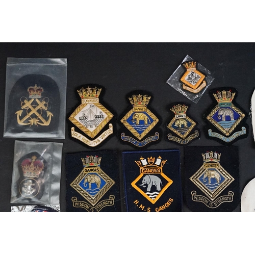 421 - A collection of British Royal Navy cloth badges to include HMS Ganges & HMS Surprise examples togeth... 