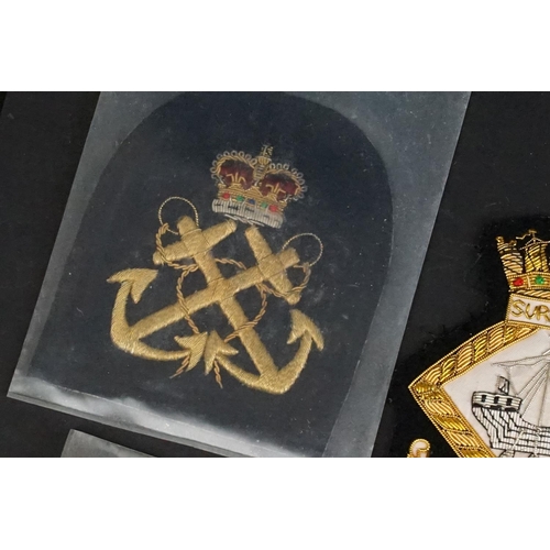 421 - A collection of British Royal Navy cloth badges to include HMS Ganges & HMS Surprise examples togeth... 