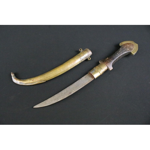 426 - A Moroccan Jambiya knife within brass scabbard together with a gun magazine.