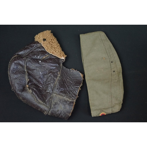 455 - A collection of military uniform and surplus to include world war two examples, lot include naval ha... 