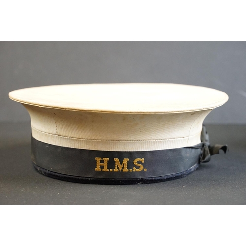 455 - A collection of military uniform and surplus to include world war two examples, lot include naval ha... 