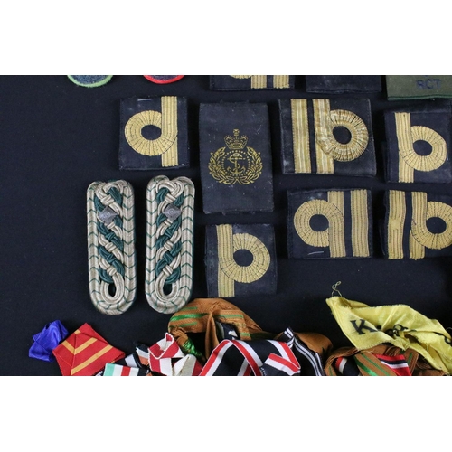 456 - A collection of mainly British and German medal ribbons and epaulettes.