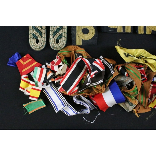 456 - A collection of mainly British and German medal ribbons and epaulettes.