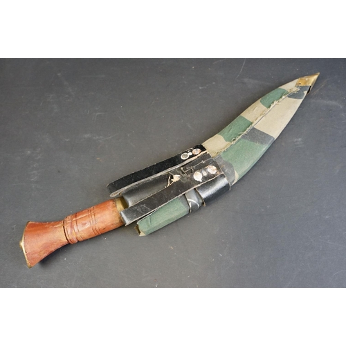 46 - A British Kukri knife (9th Gurkha Rifles), working / field knife, brass fittings with wooden handle,... 