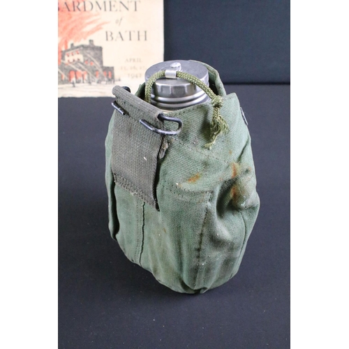 461 - A small group of military collectables to include badges, sweetheart brooch, water bottle and the bo... 