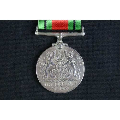 463 - A British full size World War Two / WW2 medal group of four to include the 1939-1945 Defence medal, ... 