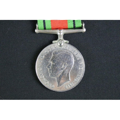 463 - A British full size World War Two / WW2 medal group of four to include the 1939-1945 Defence medal, ... 