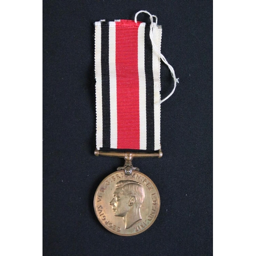 463 - A British full size World War Two / WW2 medal group of four to include the 1939-1945 Defence medal, ... 