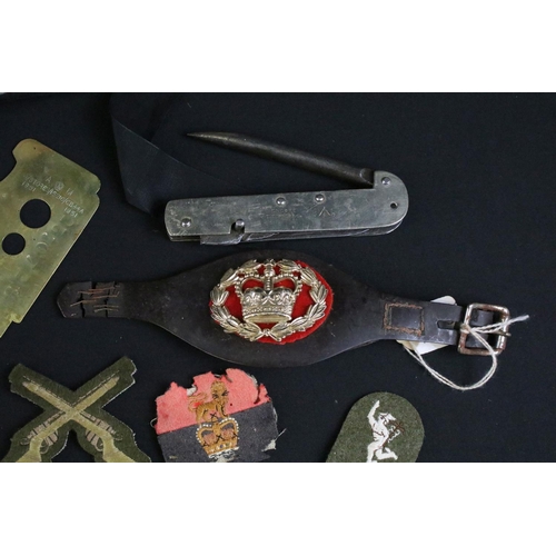 464 - A collection of mixed military collectables to include a military issued Encore Jack knife by T. Tur... 