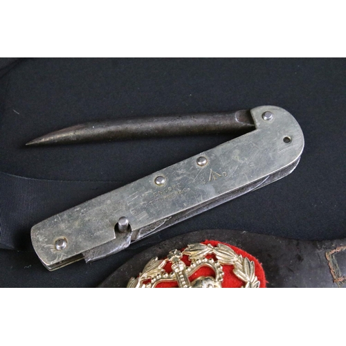 464 - A collection of mixed military collectables to include a military issued Encore Jack knife by T. Tur... 