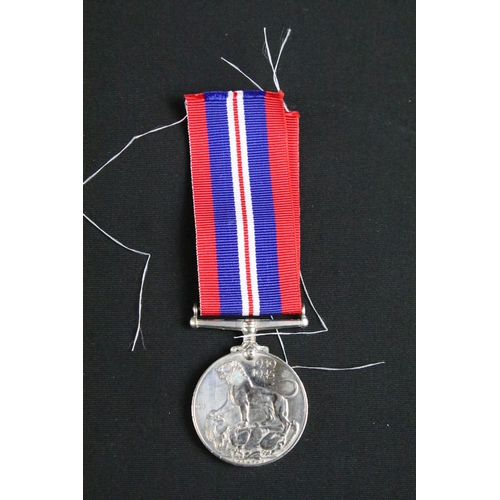 466 - A British full size World War Two / WW2 medal trio to include the 1939-1945 British War Medal, the 1... 