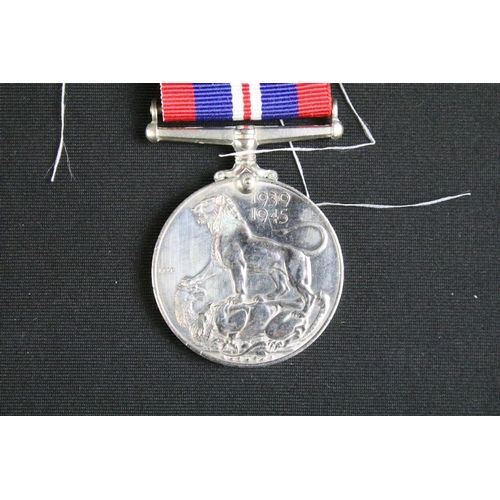 466 - A British full size World War Two / WW2 medal trio to include the 1939-1945 British War Medal, the 1... 