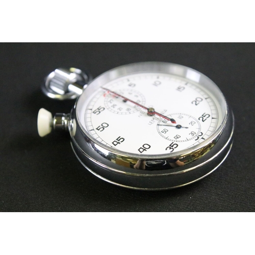 468 - A vintage 1960's British military issued Lemania stop watch, white dial with two sub dials, broad ar... 